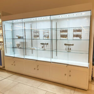 glass display cabinet in white with storage.